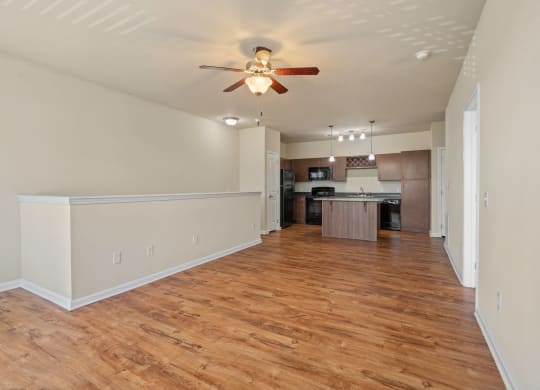 Spacious Living Area With Wood-Style Flooring