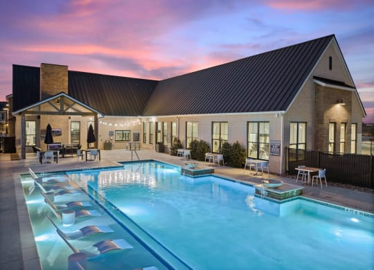 Twilight view of pool