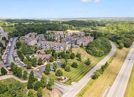 A bird's eye view of a residential area with houses and trees.