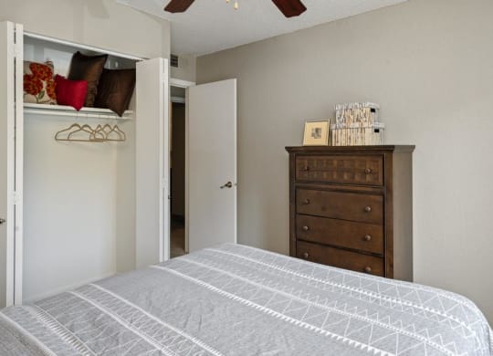 Bedroom With Accordion-Style Closet Doors