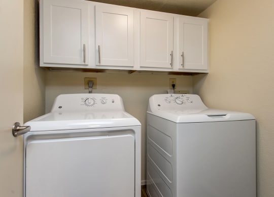 Washer & Dryer With Built-In Cabinets Above