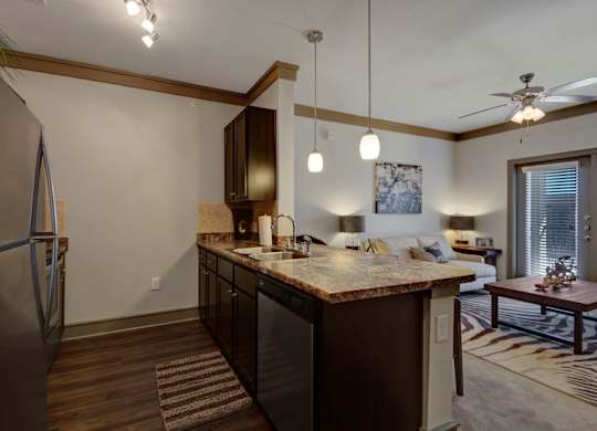 Kitchen with Dark Brown Cabinetry and Stainless Steel Appliances