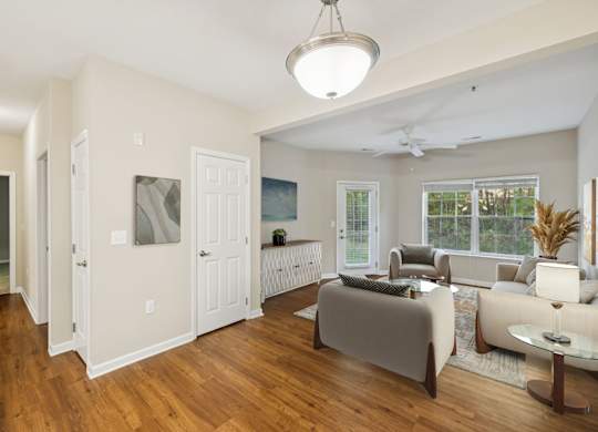 Spacious Living Area With Wood-Style Flooring