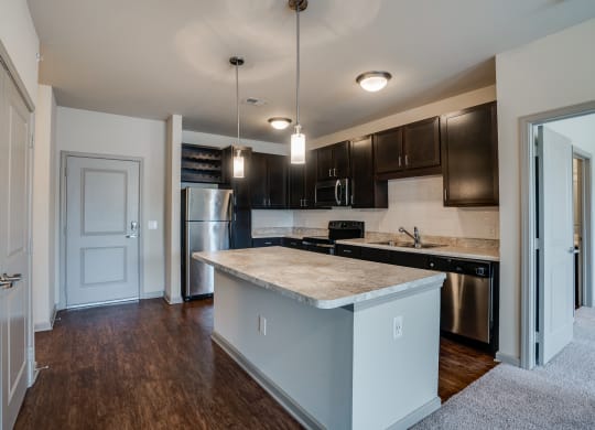 Open Concept Kitchen with Stainless Steel Appliances