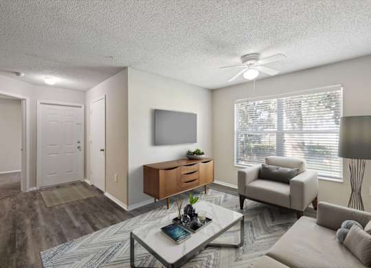 Spacious Living Area With Wood-Style Flooring