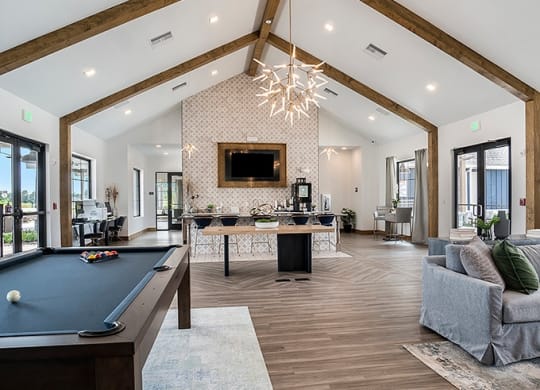 Clubhouse Kitchen & Lounge Featuring A Pool Table