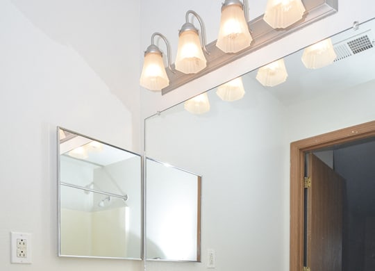 Bathroom with Vanity and Built-In Overhead Lighting