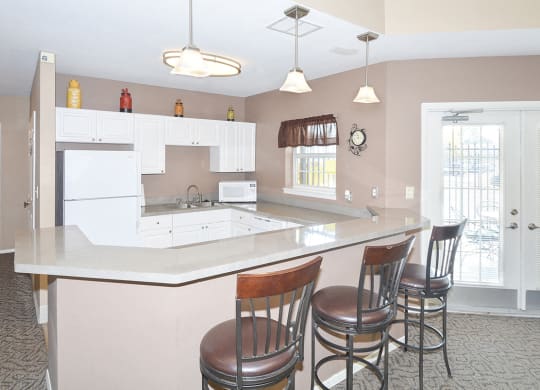 Clubhouse Kitchen with Expansive Breakfast Bar and Barstool Seating