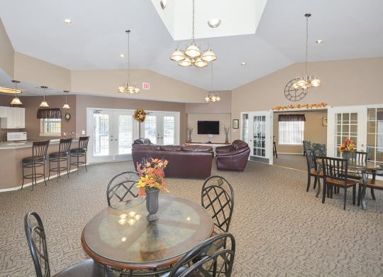 Spacious Clubhouse Lounge, Kitchen and Tables with Vaulted Ceilings