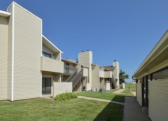 Exterior Patios and Balconies with Partial Privacy Walls with Lush Grass