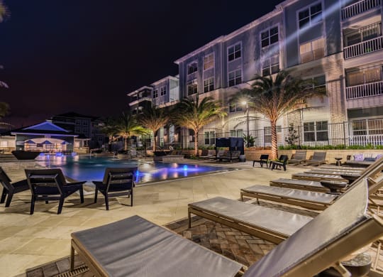 Resort-Style Pool & Sundeck Lit Up At Night