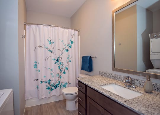 Bathroom with Stacked Washer and Dryer