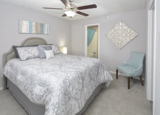 Bedroom with Plush Carpeting and Attached Bathroom