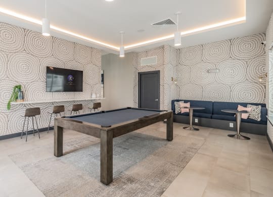 Pool Table With Adjacent Mounted Flat Screen
