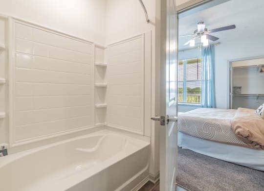 Spacious Shower & Tub With Built-In Shelving