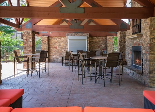 Outdoor Cabana with High Top Tables and Fireplace