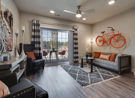 Living Room With Glass Sliding Patio Door & Wood-Style Flooring