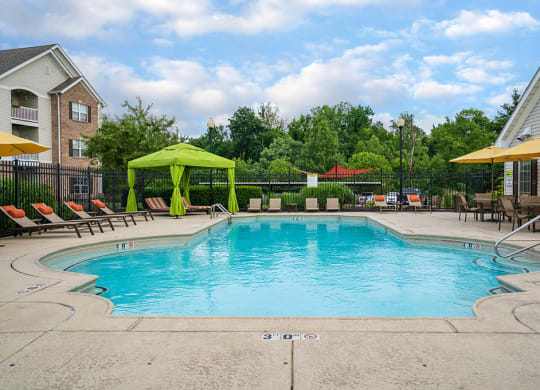 Pool Lounge Furniture with Cabana and Sun Umbrellas