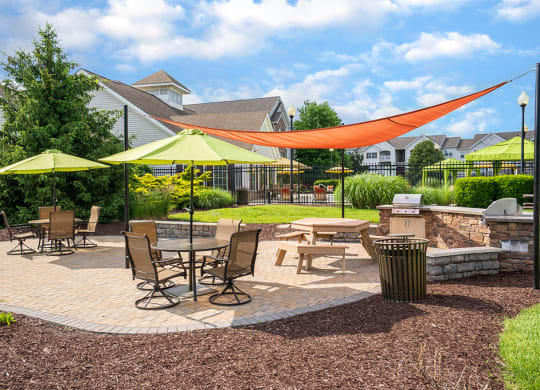 Outdoor Grilling Area with Outdoor Dining Tables