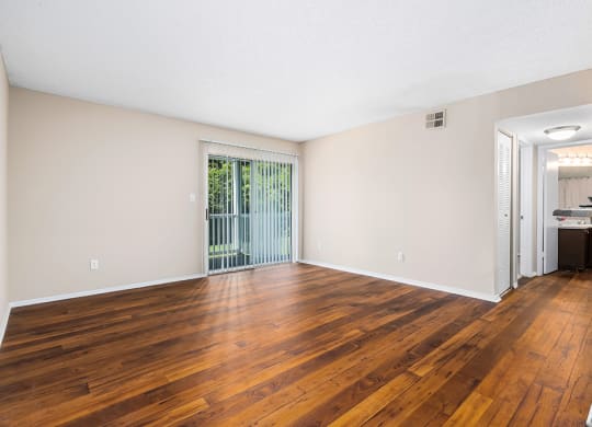Spacious Living Room Area With Patio Door & Built-In Blinds