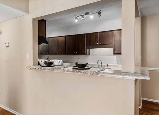 Kitchen With Peek Through Window With Breakfast Bar