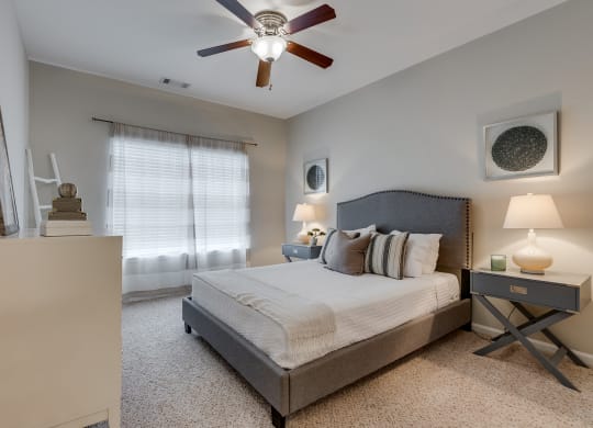 Bedroom With Tall Ceilings & Large Windows
