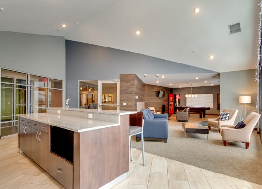 a large living room with a kitchen and a dining room