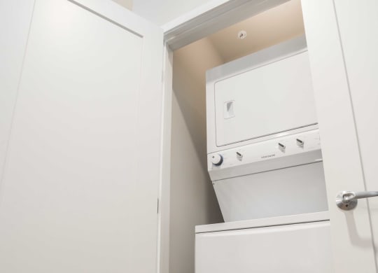 a small laundry room with a washer and dryer in it