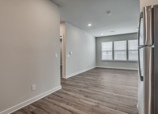 Spacious Living Area With Wood-Style Flooring