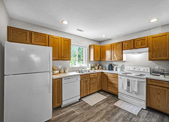 Fully Equipped Kitchen with White Appliances