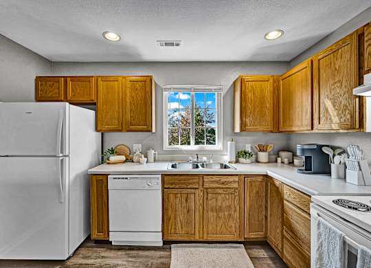 Fully-Equipped Kitchen with Wood Cabinets