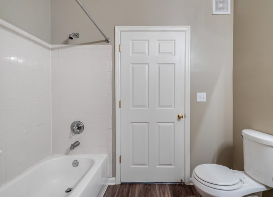 Bathroom With Wood-Style Flooring & Shower With Tub