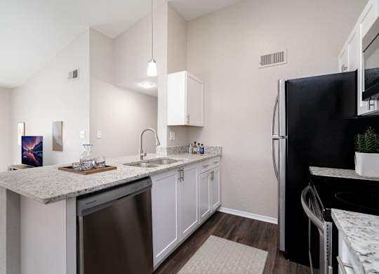Kitchen with White Cabinetry and Stainless Steel Appliances