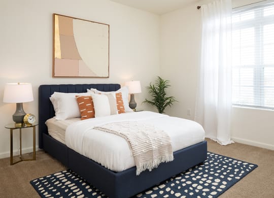 Spacious Bedroom with Large Window that lets in Lots of Natural Light