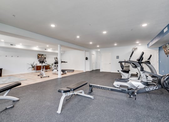 Rowing Machine & Bench At The Fitness Center