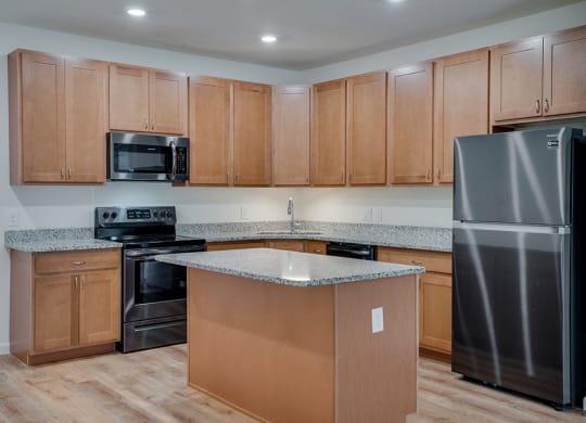 Kitchen with Stainless Steel Appliances with Recessed Lighting
