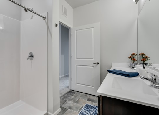 Bathroom With Walk-In Shower With Tile Flooring