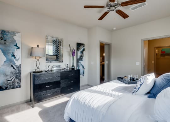 Carpeted Bedroom With Ceiling Fan & Light