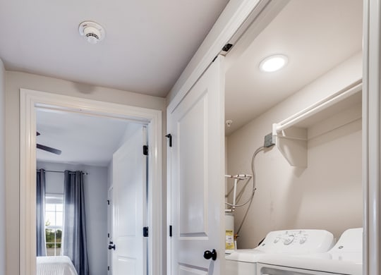 Tiled Closet with Washer and Dryer