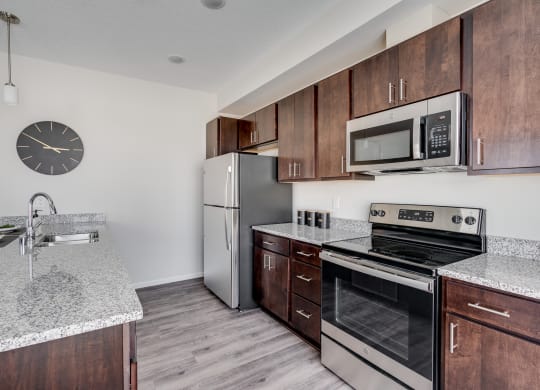 Kitchen With Granite Countertops & Stainless Steel Appliances