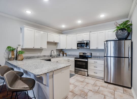 Open Kitchen with White Cabinetry