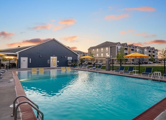 Outdoor Pool & Sundeck At Dusk