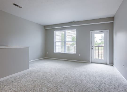 Spacious Living Area with Carpet