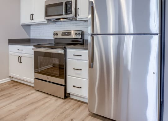 Kitchen with White Cabinetry and Stainless Steel Appliances