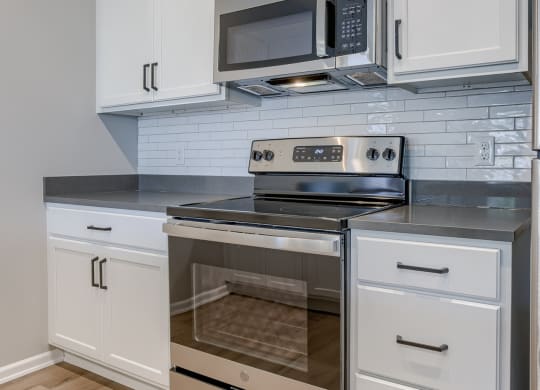 Kitchen with White Cabinetry and Stainless Steel Appliances