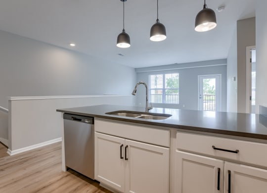 Kitchen with White Cabinetry and Stainless Steel Appliances