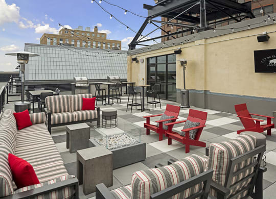 Rooftop Patio with Fire Pit Under String Lights