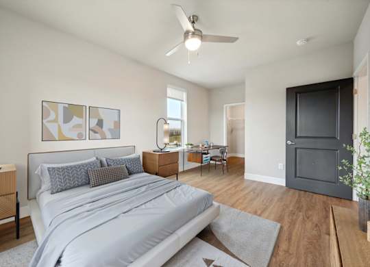 Bedroom with Wood-style flooring