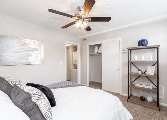 Bedroom with Sliding Closet Doors and Ceiling Fan with Light