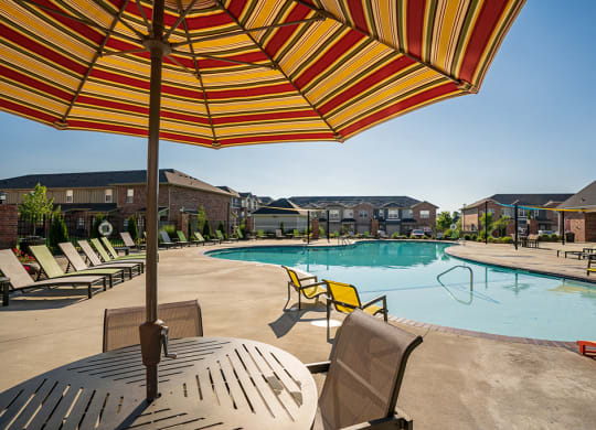 Patio Table with Sun Umbrella at the Pool Deck